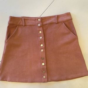 Soft suede mini skirt in pink. Snap front. In good condition. Size small.
